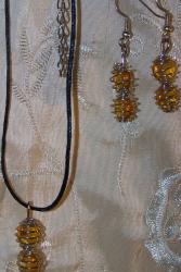 Parure cages argentées et coeurs ambre